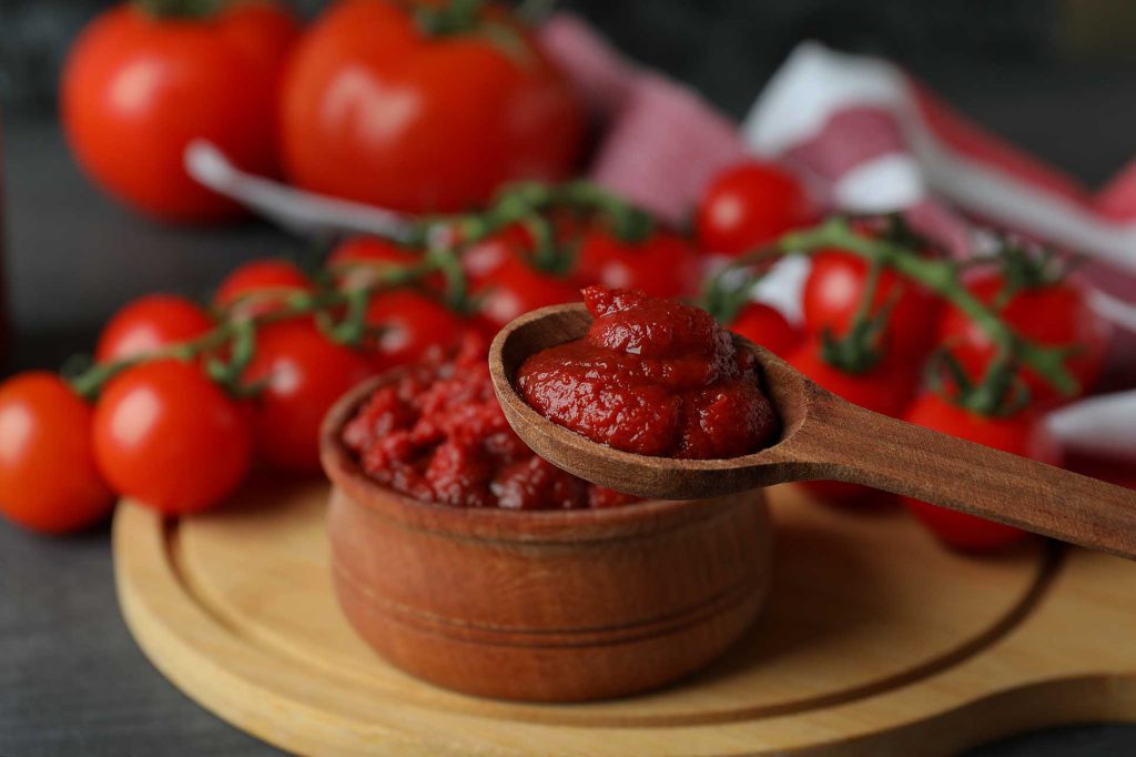 wooden-spoon-and-bowl-with-tomato-paste-close-up-2021-09-02-06-35-08-utc