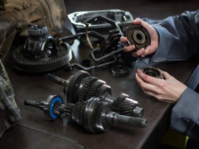 female-mechanic-holding-spare-parts-car-1-1-1024x683